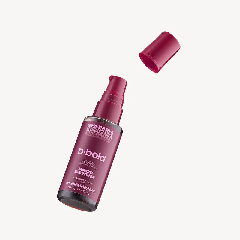 Bbold face serum bottle with cap on a white background