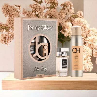 Jenny Glow product set with packaging and bottles on a wooden surface with flowers in the background