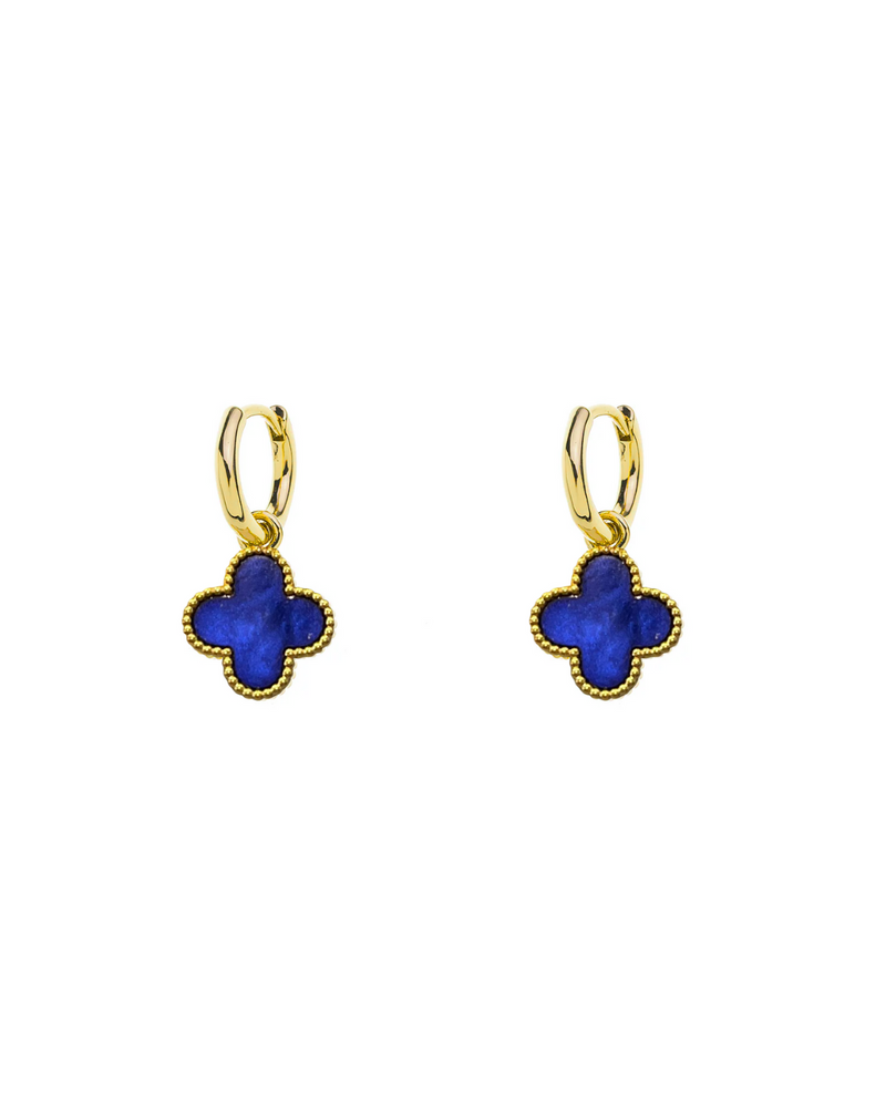 Gold earrings with blue clover-shaped stones on a white background